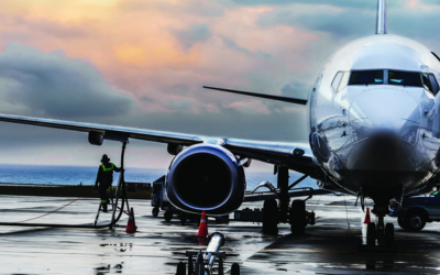 Aircraft parked at airport apron showcasing Advanced Course in Airline and Airport Operations training programs