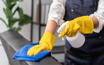 Professional housekeeping staff arranging hotel room linens during Certificate Course in Basic Housekeeping Skills